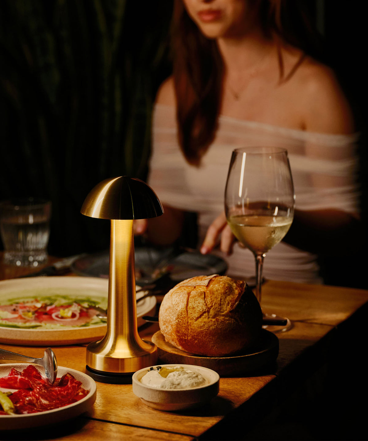NEOZ N1 Cordless Lamp Lock securing a Cooee 1C Brass table lamp at 6HEAD restaurant, Sydney