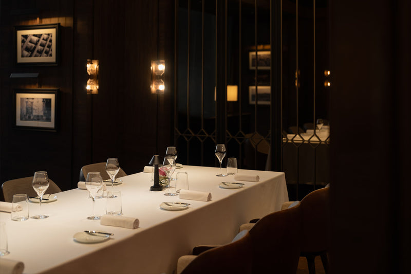 NEOZ Cooee 3C cordless lamp in sandblasted black at Cannubi by Umberto Bombana, Bangkok.