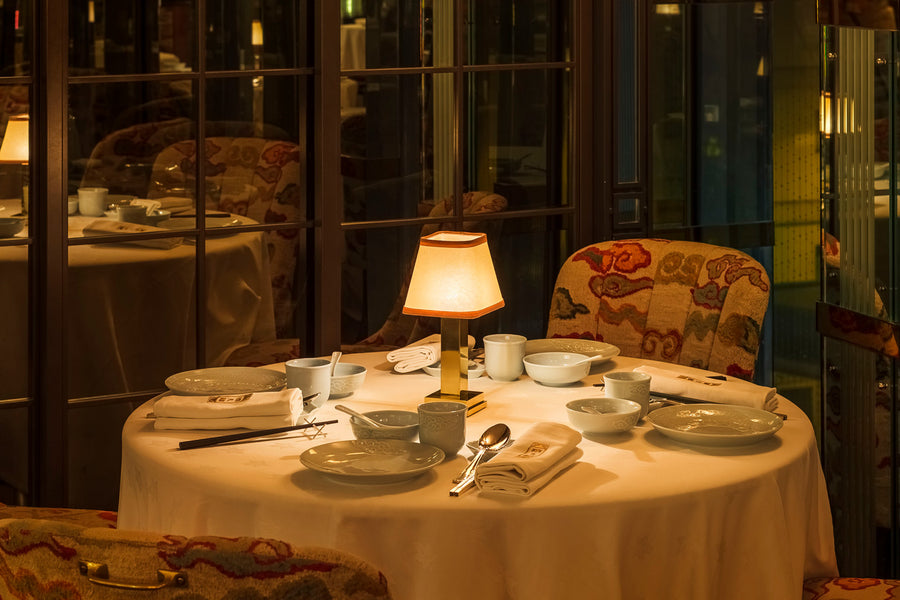 The Albert portable lamp illuminates the tables at China Tang Landmark Cantonese restaurant in Hong Kong