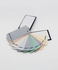 Reverse side of NEOZ cotton lampshade fabric swatches showing Pantone colour reference codes