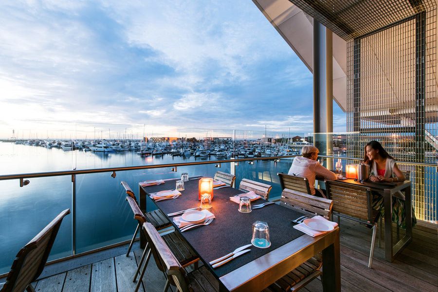 NEOZ Gem Amber cordless table lamps on waterfront restaurant terrace at Ishka Restaurant Western Australia