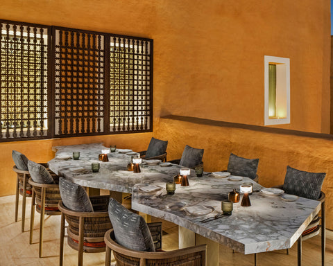 Family dining with NEOZ Piccolo Portable Lamp at Taleed by Michael Mina 
